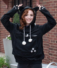 ALYC hoodie worn with pet on a walk demonstrates hands-free convenience.