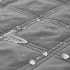 Ameritex quilted bed cover demonstrates luxurious softness guarding bedding against spills.