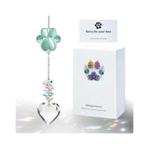 AMETHUARTZ paw crystal suncatcher displays sunlight with a calming memorial glow.