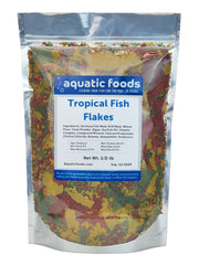 Aquatic Foods Inc Premium Community Flakes packaging highlights high-quality nutrition for diverse tropical fish.