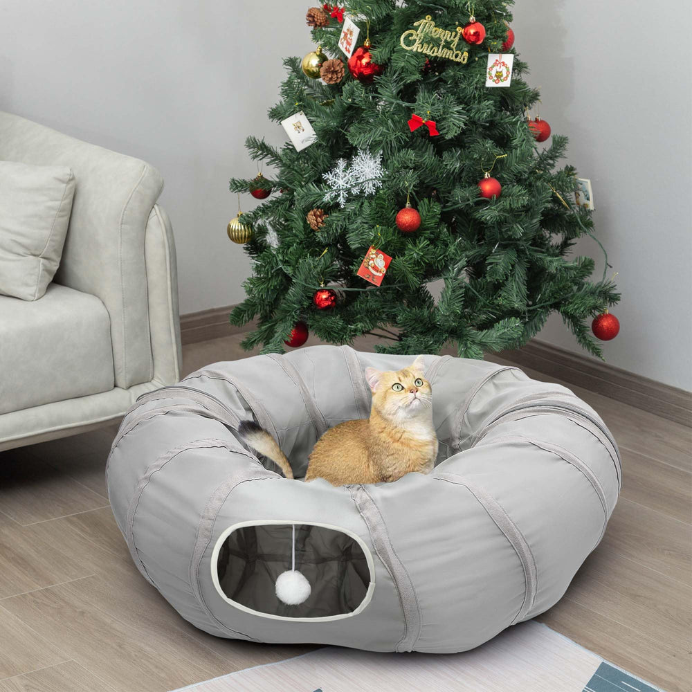 AUOON cat play tunnel under a Christmas tree for cozy play and decoration.