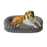 BALANCE calming dog bed 36-inch oval side view supports neck as dog curls up in comfort.