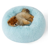 Bedsure calming donut bed close-up in aqua blue showing plush faux fur comfort for curling sleepers