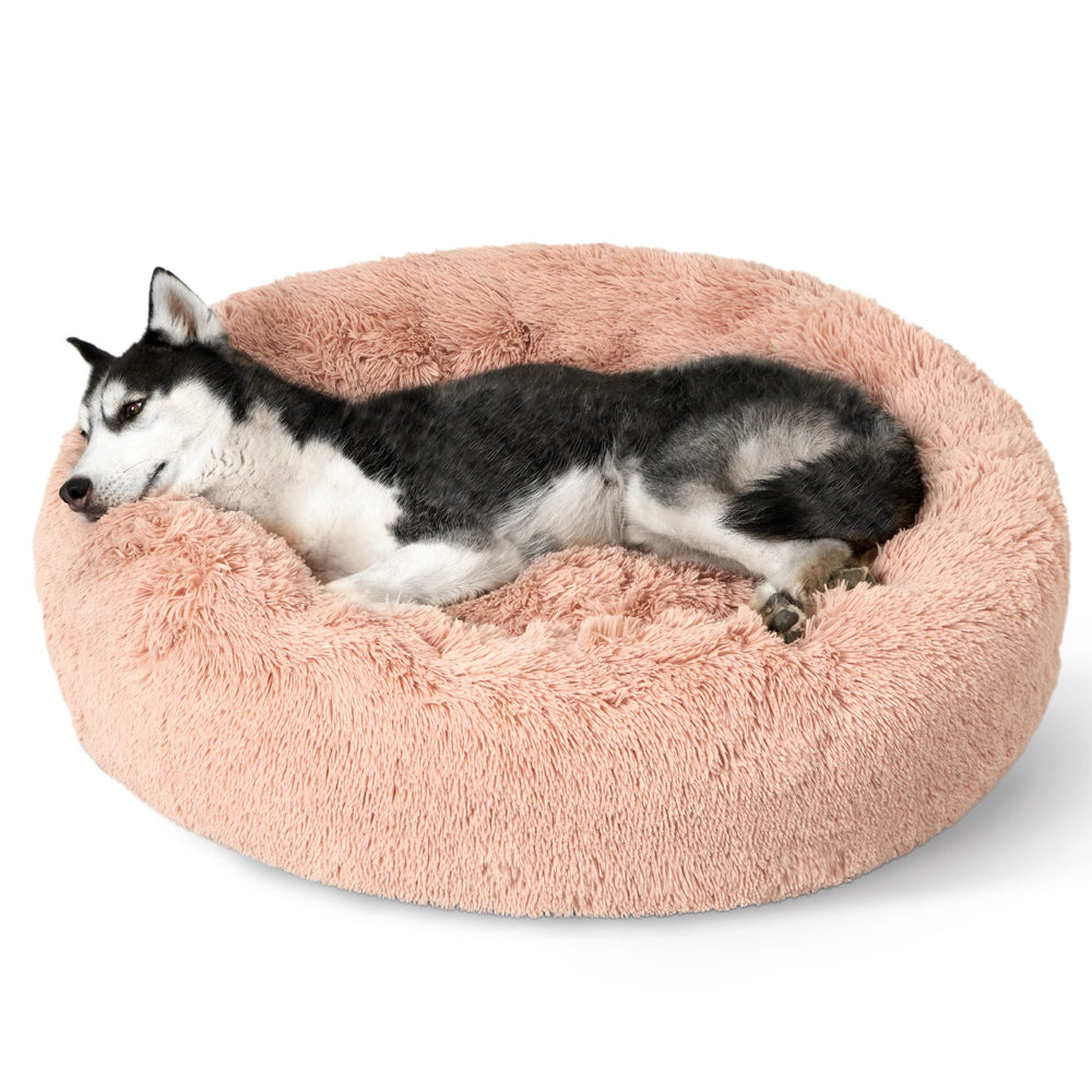Bedsure donut dog bed round pink highlighting secure curling space for calm naps.