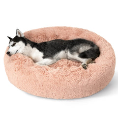Bedsure donut dog bed round pink highlighting secure curling space for calm naps.