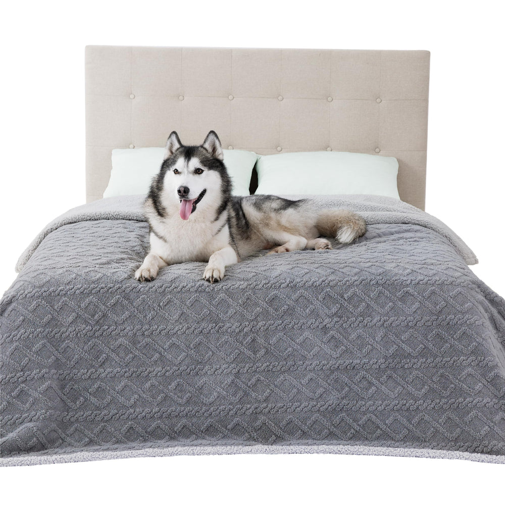 Bedsure waterproof dog blanket on bed shows spill-proof protection and cozy comfort.