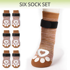 Bixie dog socks show stay-put straps for secure paw wear.