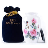 Bold & Divine hummingbird urn large with multicolor artwork for a dignified home memorial.