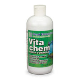 Boyd Enterprises Vitachem bottle beside a colorful freshwater tank for healthier fish