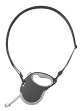 Canine Curation retractable leash with detachable strap for hands-free walking with small dogs.