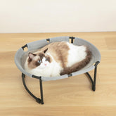 CatAve Cat Bed Hammock with oval sunken design promotes secure lounging indoors.