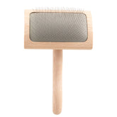Chris Christensen Mark VI curved slicker brush close-up showing stainless pins for gentle detangling
