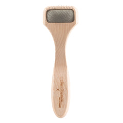 Chris Christensen A5X Mark X Slicker Tiny Head closeup highlighting precision pins for gentle grooming.