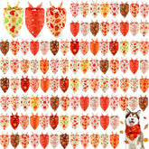 Chunful pumpkin-pattern bandanas on dogs for festive fall photos.
