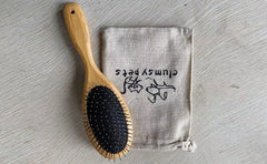 Clumsy Pets ball pin slicker brush stainless steel pins for detangling efficiency.