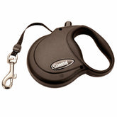 Coastal Power Walker retractable leash extended in park for balanced dog freedom and control.