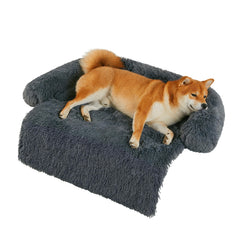 The Codi calming dog bed on the sofa showcases anti-anxiety comfort with a secure non-slip bottom.