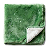 CREW FLX waterproof blanket on bed showing 40x60 coverage for naps and movie nights