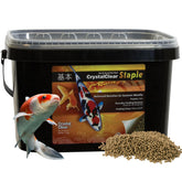 CrystalClear Staple pellets floating in water for easy pond feeding.