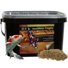 CrystalClear Staple pellets floating in water for easy pond feeding.