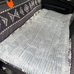 Cshionary dog bed for car with soft fabric enhances cozy in-vehicle rest.