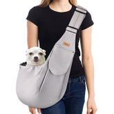 CUBY dog sling carrier in grey classic worn during a casual walk for easy pet transport