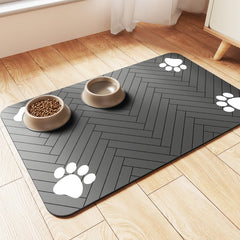 DK177 pet feeding mat absorbs spills during meals on striped dark gray surface.