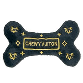 Dog Diggin Designs Runway Pup bone toy with bold colors and squeaker for interactive play.