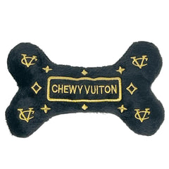 Dog Diggin Designs Runway Pup bone toy with bold colors and squeaker for interactive play.