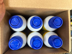 Dr. Naylor Blu-Kote Aerosol applied to a dog's wound for targeted protection.