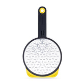 Dreamfarm Ograte bottom-side blades in motion for fast, even grating