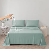 DUJUIKE waterproof bed cover on bed protects mattress from spills and accidents.