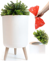 Earth & Mango small outdoor trash can with lid, plant-inspired exterior for discreet waste disposal.