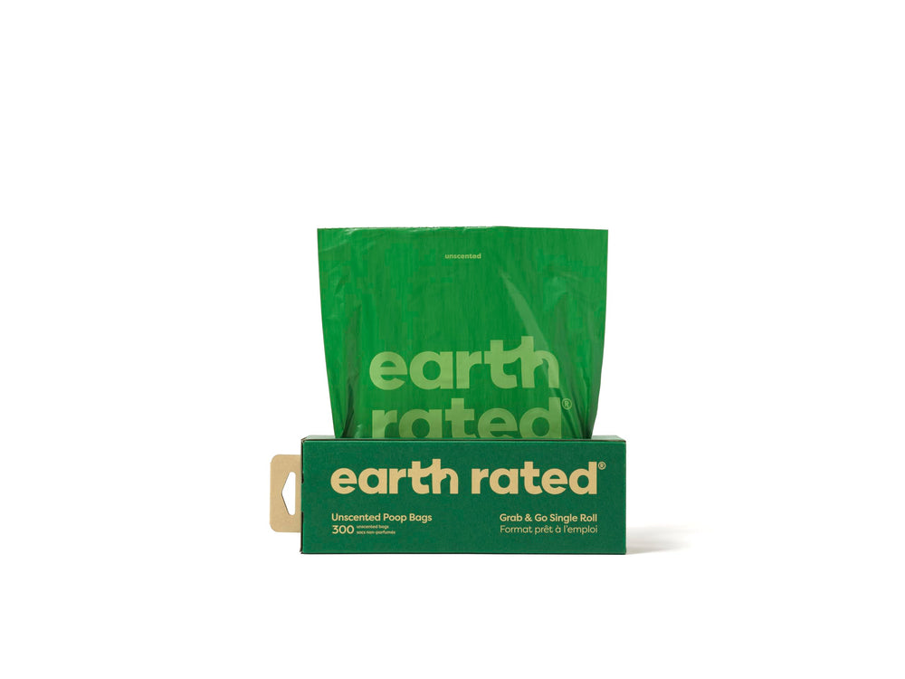 Earth Rated dog poop bags in a thick grab-and-go roll for easy unscented backyard pickups.
