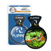 FLIPPER DeepSee Nano 3in magnifier on tank glass for crystal-clear underwater viewing.