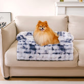 Funny Fuzzy couch cover in tie-dye blue protects sofa while keeping pets comfy.
