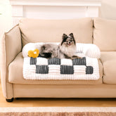 Funny Fuzzy pet couch cover on sofa-cream-plaid protects furniture while adding cozy style.
