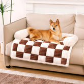 Funny Fuzzy pet couch cover on a sofa protects furniture with plush fabric.