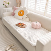 FUNNY FUZZY pet couch cover on a white sofa protects furniture from scratches and pet hair.