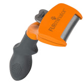 FURminator ergonomic-handle image showing comfortable deshedding of loose fur