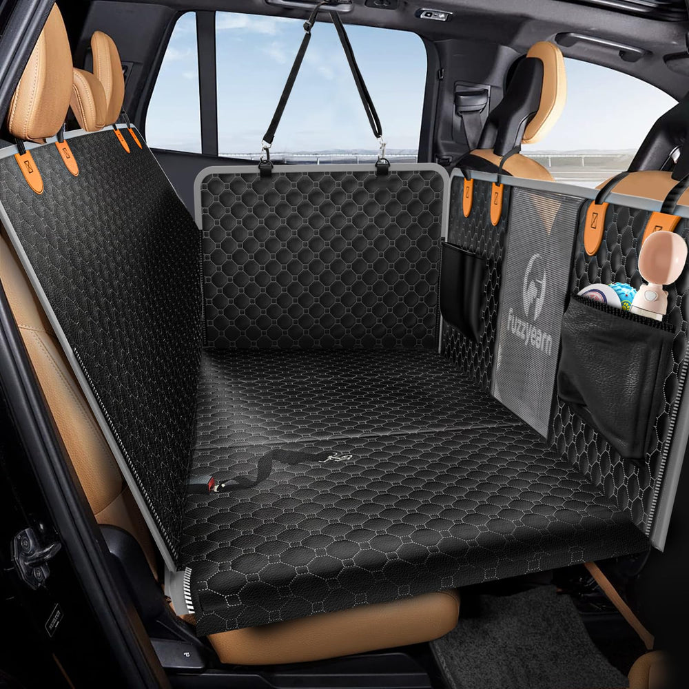 Fuzzyearn leather back seat extender installed with expanded space for dogs on trips.