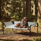 Gardner Pet elevated dog bed guardrail side view showing secure outdoor lounging
