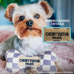 Checker Chewy Vuiton Bone in action during dog play for engagement.