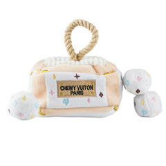 Haute Diggity Dog White Chewy Vuiton trunk demonstrates stylish, interactive play for enrichment.