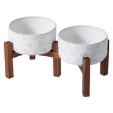 Havniva ceramic raised double bowls with acacia stand improve feeding posture for small dogs.