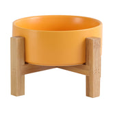 HCHLQLZ elevated ceramic cat bowl in yellow with stable stand for comfortable feeding.