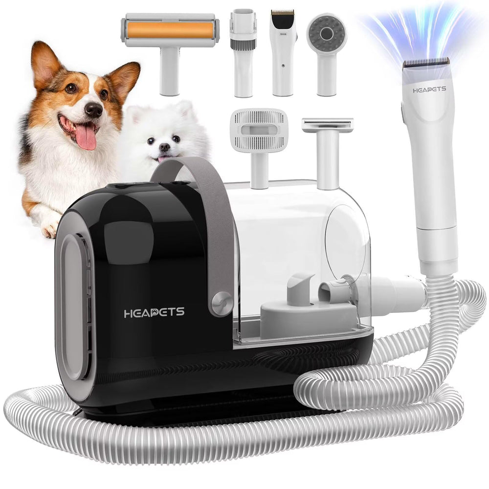 HEAPETS dog grooming vacuum kit in action capturing fur during a trimming session.