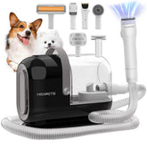 HEAPETS dog grooming vacuum kit in action capturing fur during a trimming session.