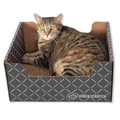 Hide & Scratch cardboard scratcher box bed inviting feline enrichment and cozy lounging.