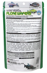 Hikari tropical algae wafer texture close-up highlights spirulina-rich formula.